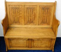 An oak monks bench with linenfold design to back 3