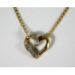 A 9ct gold necklace & pendant set with diamonds 2.