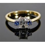 An 18ct gold ring set with 0.5ct emerald cut diamond & sapphire 3.3g size N/O