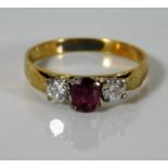 An 18ct gold ring set with 0.31ct diamond & 0.45ct ruby 2.5g size N