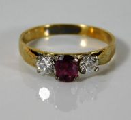 An 18ct gold ring set with 0.31ct diamond & 0.45ct ruby 2.5g size N