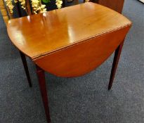A 19thC. mahogany Pembroke table with D shaped lea