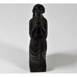 An early carved wooden figure inscribed Ora Pro No