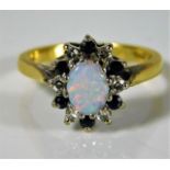 An 18ct gold ring by B. Morris set with approx. 0.18ct diamond, sapphire & opal 3.8g size L