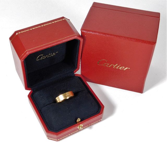 An 18ct gold Cartier "Love" ring with inner & outer box 9g size T/U