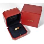 An 18ct gold Cartier "Love" ring with inner & outer box 9g size T/U