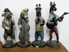 A quartet of modern figures of dogs playing musica