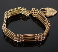 A 9ct gold four bar gate bracelet with engraved cl