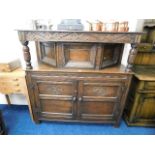 An oak court cupboard with cupboard