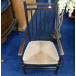 An Ernest Gimson style low level chair