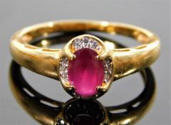 An 18ct gold ring set with ruby & diamond 3.8g siz