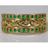 A 14ct gold ring set with emeralds 4g size R/S