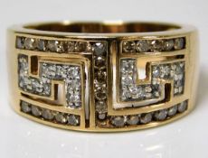 A 9ct gold ring set with diamonds, lacking two sto