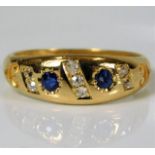 An 18ct diamond & sapphire ring 4.2g size N/O