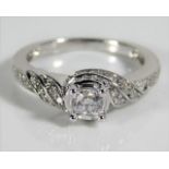 An 18ct white gold ring set with diamonds, centre