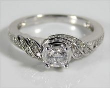 An 18ct white gold ring set with diamonds, centre