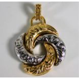 An 18ct two colour gold Algerian love knot pendant