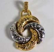 An 18ct two colour gold Algerian love knot pendant