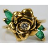 A 14ct gold ring with rose design set with diamond