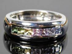 An 18ct white gold half eternity ring set with rai