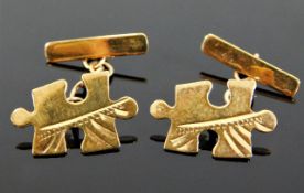 A pair of 9ct gold cufflinks of puzzle design 2g