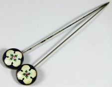 Two antique hat pins with enamelled decor