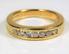 An 18ct gold half eternity ring with approx. 0.33c