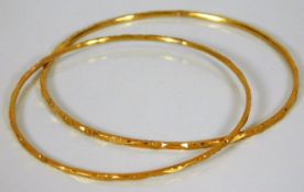 Two yellow metal bangles, test as 18ct gold, 16.1g