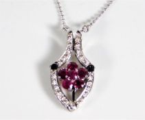 A 14ct white gold necklace with 14ct gold metamorp