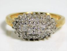 A 9ct gold ring set with 0.5ct diamonds 4g size P