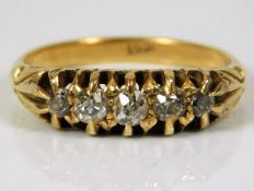 An antique 18ct gold ring set with five diamonds o