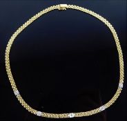 An 18ct gold necklace set with approx. 0.35ct diam