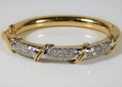 An 18ct gold bangle set with approx. 3ct diamond 3