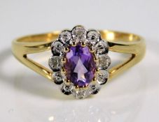 A 9ct gold ring set with amethyst & diamond 2.1g s