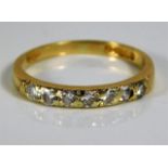 An 18ct gold half eternity ring set with diamonds