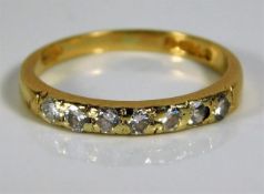 An 18ct gold half eternity ring set with diamonds