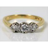 An 18ct gold ring with platinum mount set with app