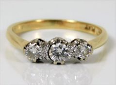 An 18ct gold ring with platinum mount set with app