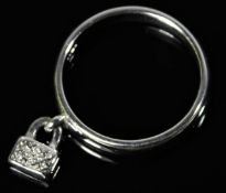 A 9ct white gold ring with small padlock set with