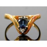 A 14ct gold ring set with small diamond & sapphire