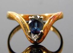 A 14ct gold ring set with small diamond & sapphire