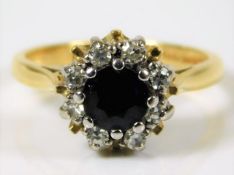 An 18ct gold ring set with sapphire & approx. 0.25