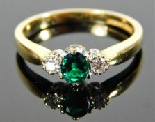 An 18ct gold emerald & diamond ring 3.8g size P