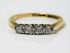 An 18ct gold ring set with platinum mounted diamon