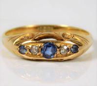 An antique 18ct gold ring set with diamond & sapph