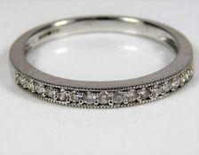 A 9ct gold half eternity ring set with 0.17ct diam