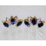 An 18ct gold earrings set with diamond & sapphire