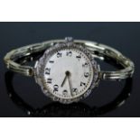 An early 20thC. guilloche dial watch with white me