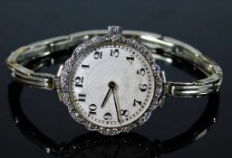An early 20thC. guilloche dial watch with white me