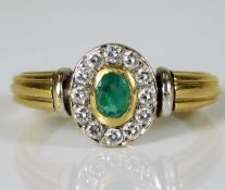 An 18ct gold set with emerald & approx. 0.36ct dia